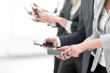 closeup.a group of employees with smartphones