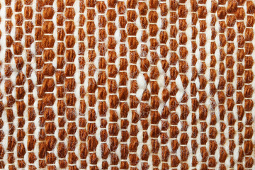 White and brown wool yarn cloth background. Surface of fabric texture in two tone colors.