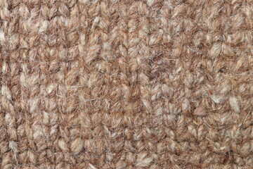Brown wool yarn cloth background. Surface of fabric texture in pale brown color.