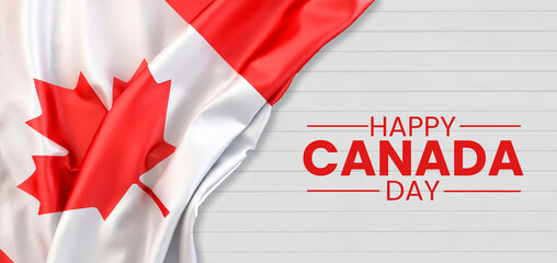 Fototapeta na wymiar happy Canada day lettering with the flag of Canada over wooden texture background