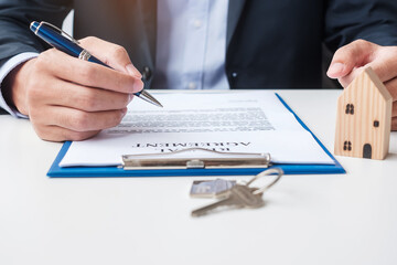 man signing home contract documents. Contract agreement, real estate,  buy and sale and insurance concepts