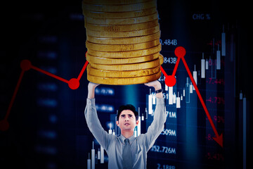 Businessman hold coins with declining price chart