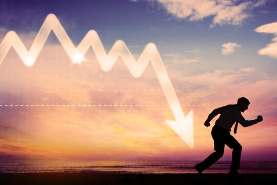 Businessman run away from declining arrow on beach