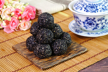 Black sesame ball, Chinese super food reduce oxidation in the body, improve blood pressure, and provide antioxidants and other plant chemicals that help fight cancer. Selective focus with copy space