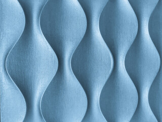 Light blue 3D interior decorative wall panel with unusual wavy geometric shape. Denim background...