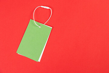 white price tag on a red isolated background, price tag for goods