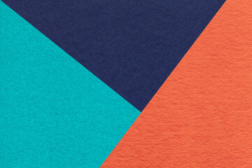 Fototapeta premium Texture of craft blue, cerulean and orange color paper background, macro. Vintage abstract cyan cardboard