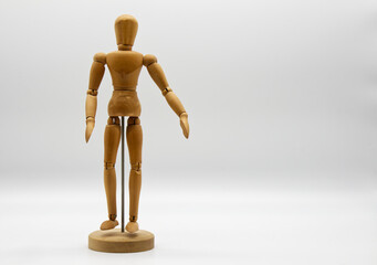 Wooden figure isolated on white background. Wood Figure Mannequin. Space for text.