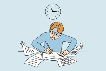 Worried man writing anxious about deadline 
