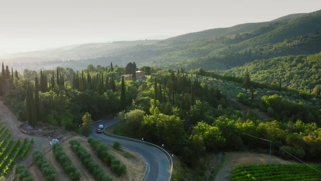 Drone view of sun setting over cyprus hills in Chianti, Tuscany, Italy.