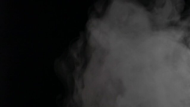 Transparent smoke clouds, abstract fog, white steam texture on black background
