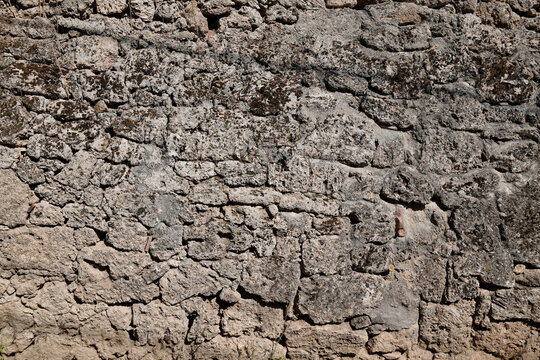 Old ancient stone wall background facade horizontal stones wallpaper
