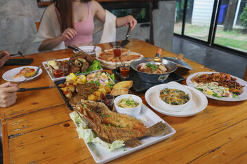 A variety of dishes are laid out on the table to prepare for family and friends banquets during New Year's Eve. Diverse food preparation ideas for family and friends parties during the festive season.