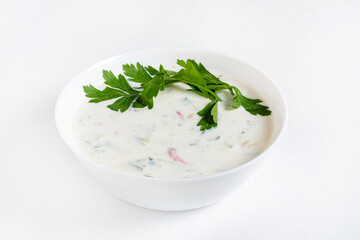 Cold soup with cucumbers, yogurt and fresh herbs