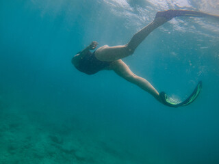 woman in snorkeling mask underwater