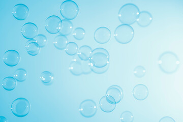 Fototapeta na wymiar Abstract Beautiful Transparent Blue Soap Bubbles Background. Soap Sud Bubbles Water 