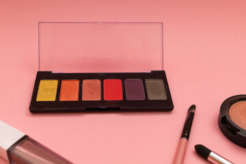 Cosmetics on a pink background, subject photography