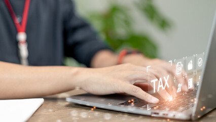 Business use a computer to complete Individual income tax return forms online for tax payment. Government, state taxes. Data analysis, paperwork, financial research, report. Calculation of tax return.