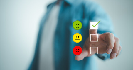 Man choosing green happy smile face icon. feedback rating and positive customer review experience, satisfaction survey. mental health assessment. world mental health day concept. - obrazy, fototapety, plakaty
