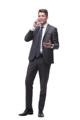 confident young businessman talking on his smartphone. isolated on white