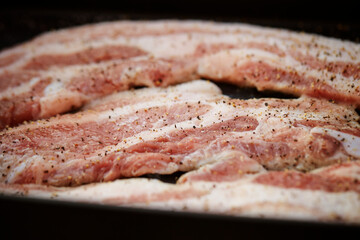 Raw pork belly in a pan