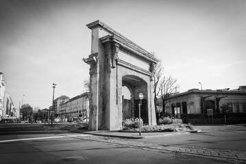 Fototapeta na wymiar Porta Romana (translation: Roman's Gate) monument and square, Milan, Italy. Monochromatic.