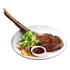 Isolated portion of grilled beef tomahawk steak on white background