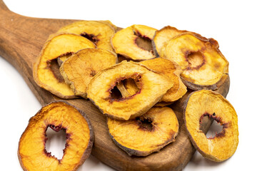 Dried peach slices. Sliced dry peach isolated on white background. Sun-dried fruit. Close up