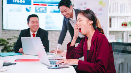 A business woman is tired from a long meeting.