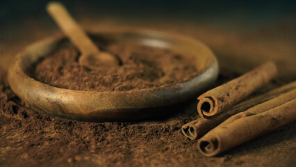 cinnamon ground sticks ceremony cocoa cloves ground coffee spices on wooden table closeup