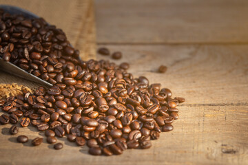 Coffee bean on wooden table background. Food and beverage concept