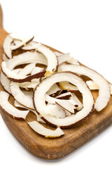 Dried coconut slices. Sliced dry coconut isolated on a white background. Sun-dried fruit. close up