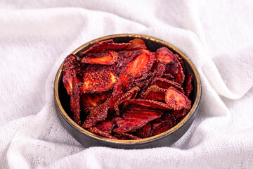 Dried strawberry slices. Sliced dried strawberries on a white background. Sun-dried fruit. close up