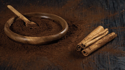 cinnamon ground sticks ceremony cocoa cloves ground coffee spices on wooden table closeup
