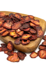 Dried strawberry slices. Sliced dried strawberries isolated on a white background. Sun-dried fruit. close up