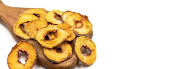 Dried peach slices. Sliced dry peach isolated on white background. Sun-dried fruit. Close up. Copy space