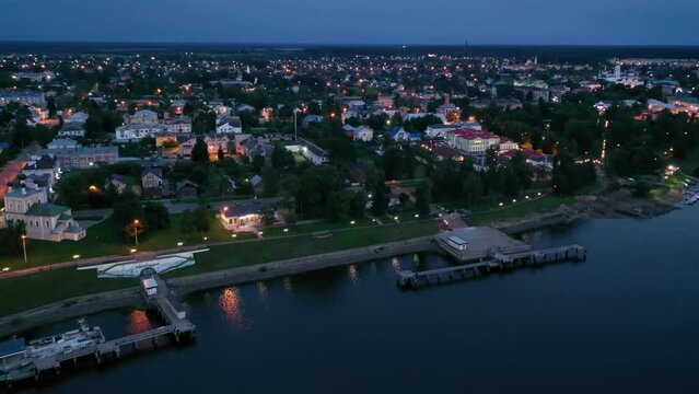 Flight over evening city of Uglich and Epiphany Cathedral on the banks of Volga River