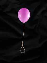 Flying balloon with gallows rope, noose or hangman knot on black background. Abstract creative...