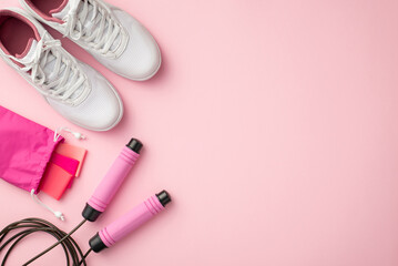 Fitness accessories concept. Top view photo of white sneakers pink resistance bands in special bag...