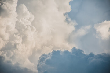 Beautiful blue sky with clouds. Anime sky clouds, anime style. Dramatic white clouds and sunlight. Anime sunrise pastel background. Sky background for animation or designer.

