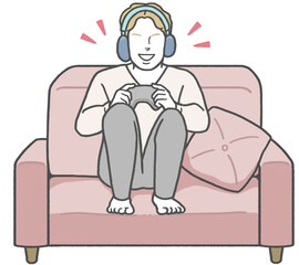A young Western man sitting on a sofa wearing headphones, enjoying a video game alone