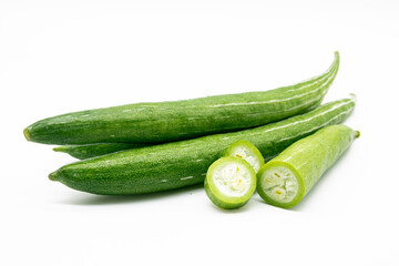whole and slices fresh Snake gourd isolated on white background.
