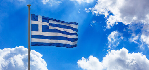 Greece sign symbol. Greek national official flag on flagpole waving in the wind, blue sky