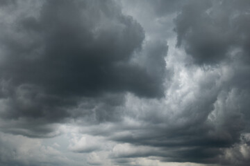 Obraz premium A dramatic dark storm cloudy sky or cloudscape. Wide-angle view, gray clouds, no people