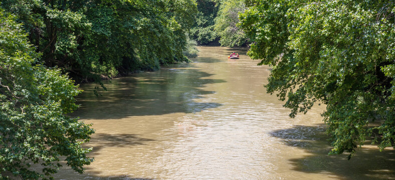 Greece. Vale of Tempi, Thessaly. Pineios River water flow, tree on the bank, above