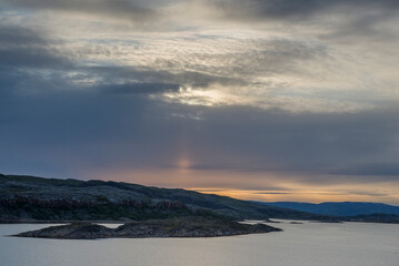 Fototapeta na wymiar View of the Midnight Sun in the Norwegian Sea,