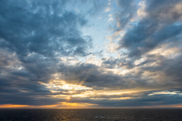 View of the Midnight Sun in the Barents Sea, from the deck of a ship