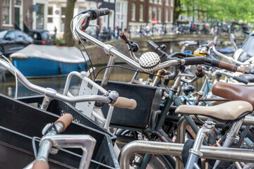 Bicycles parked background. Bikes parking at Amsterdam city center, close up. Netherlands Holland