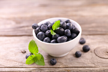 blueberry fruit and mint in bowl