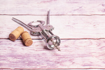 Cork on corkscrew on a wooden background